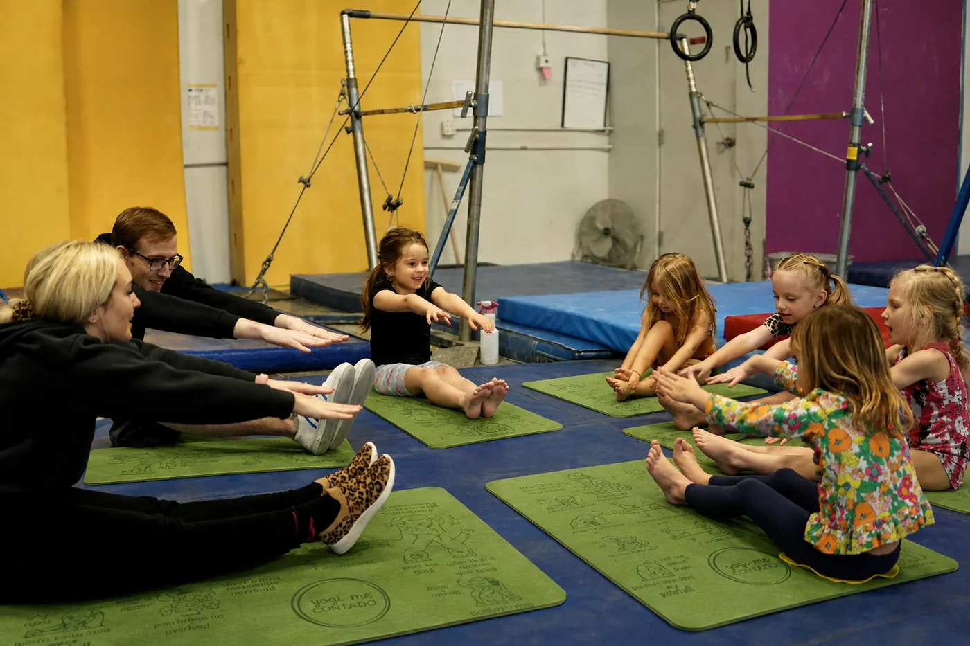 A children's yoga class on green Yogi-Me mats
